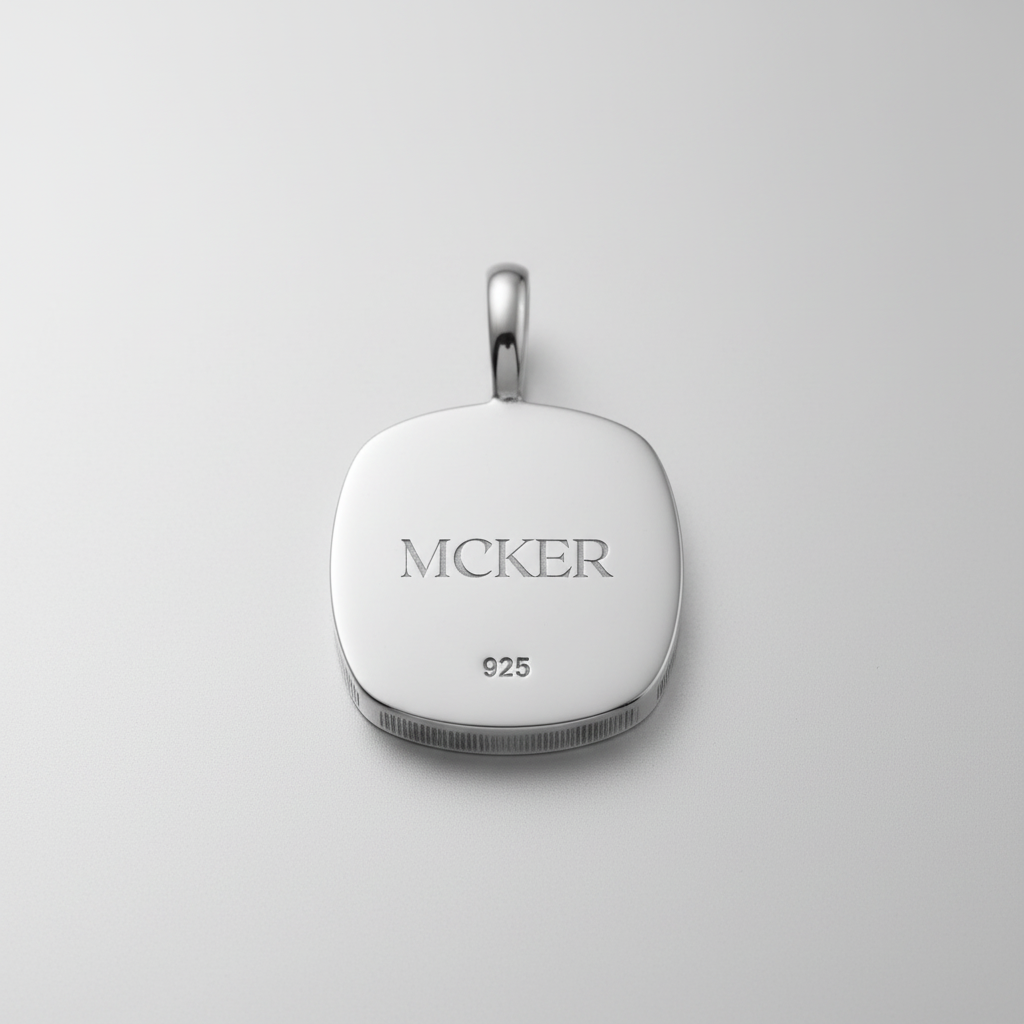 Back of MCKER cheetah pendant displaying authentic 925 sterling silver hallmark and brand logo.