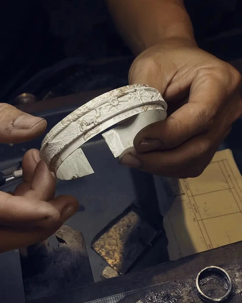 Picture of the jeweler working on sahara cuff from MCKER