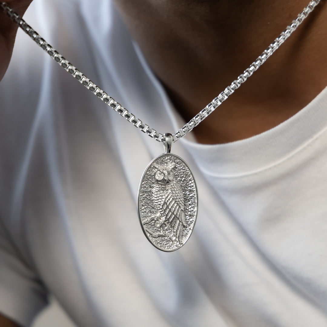 Model wearing MCKER sterling silver owl pendant necklace

