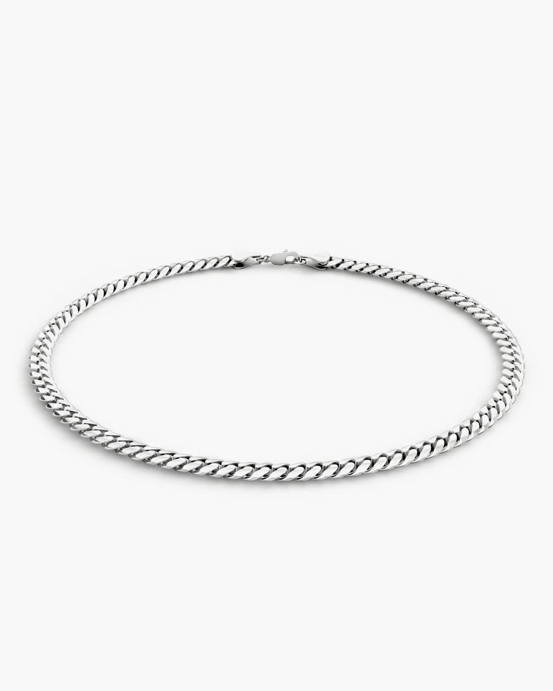 Men’s 3mm sterling silver Cuban link bracelet shown from a low side angle.
