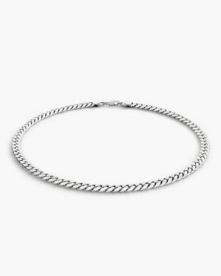 Men’s 3mm sterling silver Cuban link bracelet shown from a low side angle.
