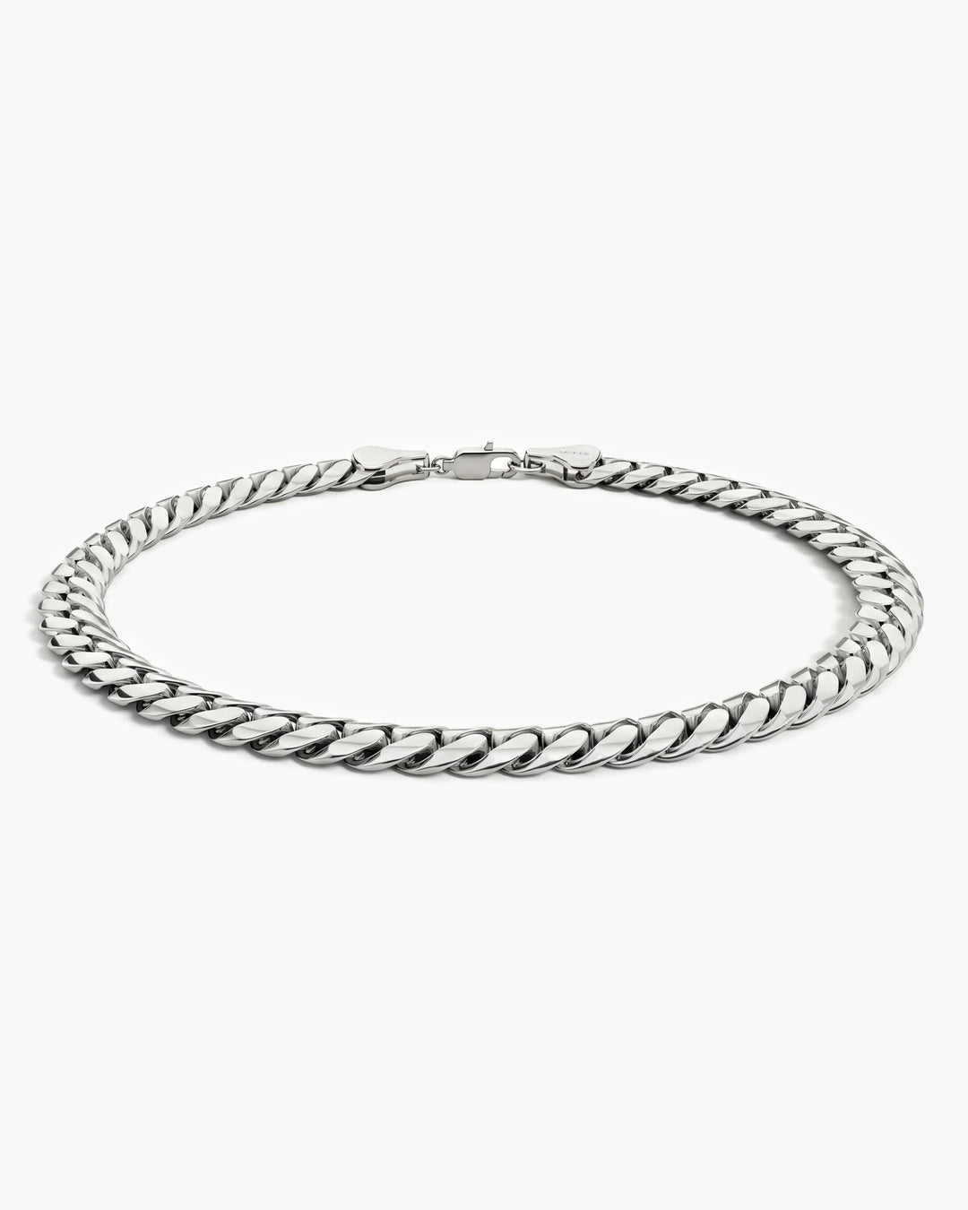Men’s 5mm sterling silver Cuban link bracelet shown from a low side angle.