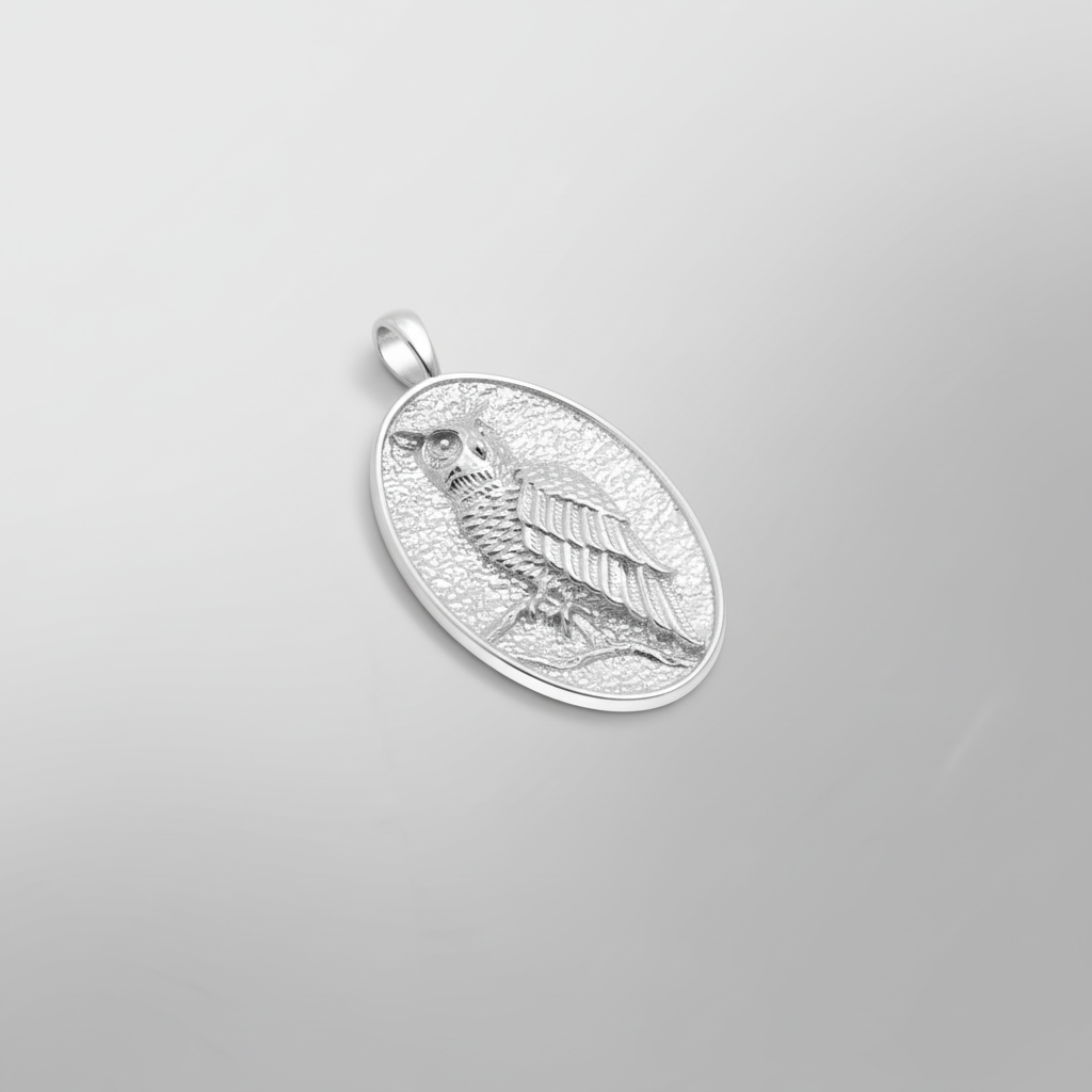 MCKER owl pendant angled view showcasing dimensional craftsmanship and textured sterling silver details