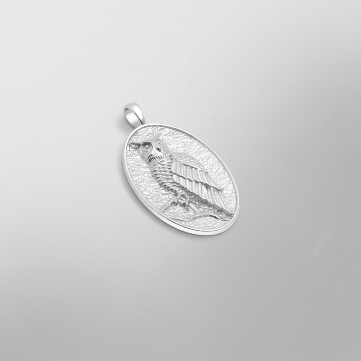 MCKER owl pendant angled view showcasing dimensional craftsmanship and textured sterling silver details