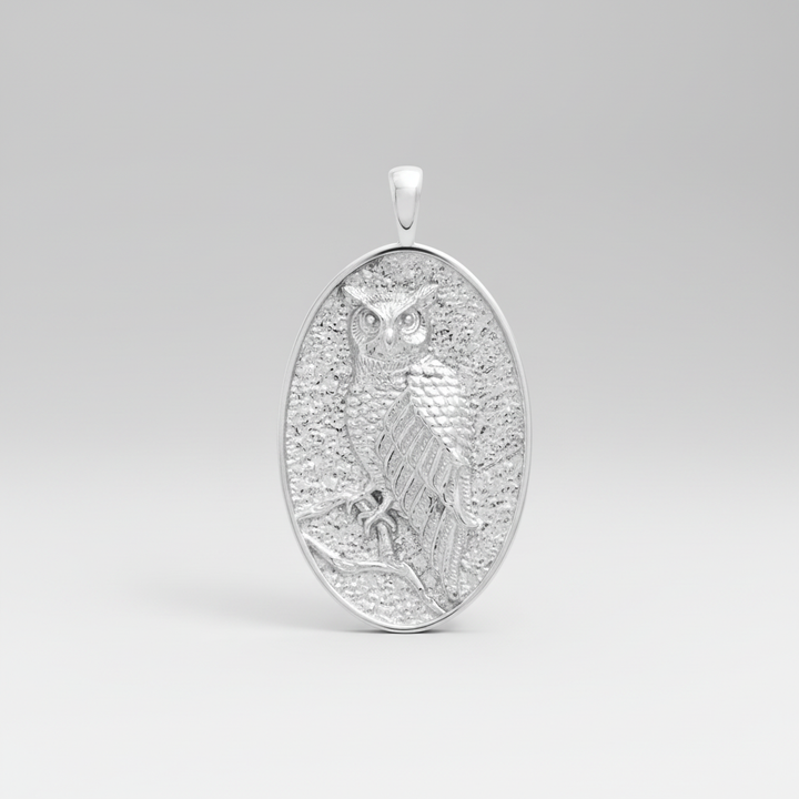 MCKER sterling silver owl pendant front view showing intricate feather details and wise owl design
