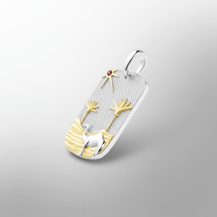Dynamic view of MCKER Sahara pendant showing depth and dimension of sterling silver and 18K gold desert design