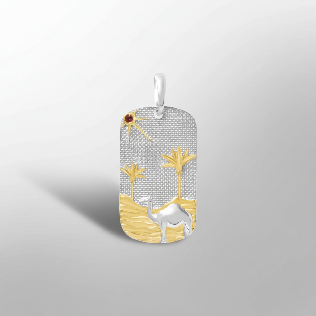 Sterling silver Sahara pendant with 18K gold desert scene featuring camel, dunes, and palm trees with red garnet sun.