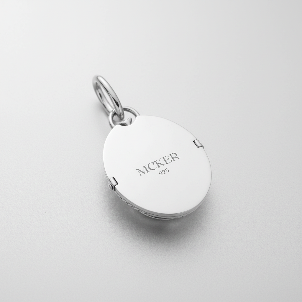 Back of MCKER scarab pendant displaying authentic 925 sterling silver hallmark and brand logo.