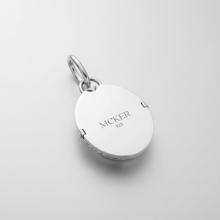 Back of MCKER scarab pendant displaying authentic 925 sterling silver hallmark and brand logo.