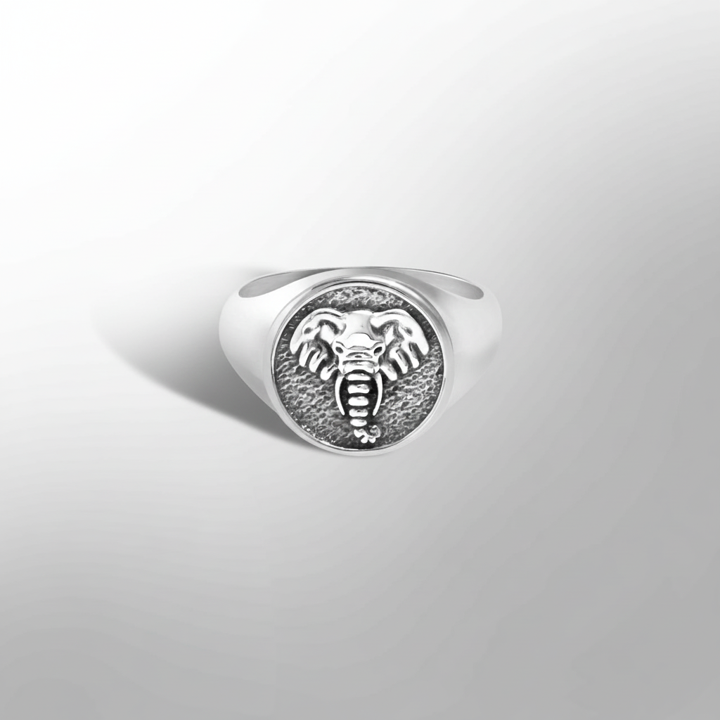 MCKER tusked ring hero shot with artistic low angle perspective emphasizing bold tusk design