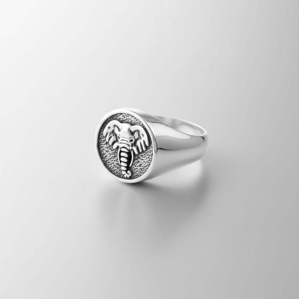 MCKER tusked ring three-quarter view displaying band profile and dimensional tusk details