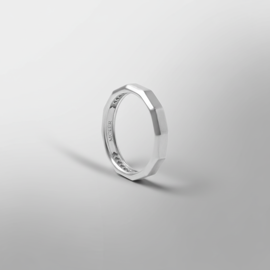 MCKER twelve cut sterling silver ring top view showcasing circular design and intricate cut pattern